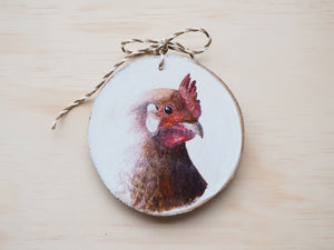 Holzscheibe mit feinem Huhn